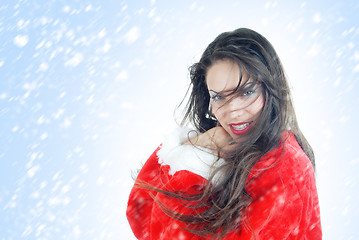 Image showing Happy female Santa in snowstorm