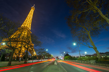 Image showing Wonderful colors of Eiffel Tower. Winter sunset with car light t