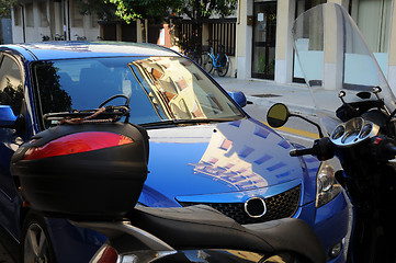 Image showing Building Reflection on the Car