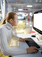 Image showing Young girl and blank monitor.
