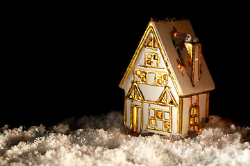 Image showing Little toy house covered with artificial snow.