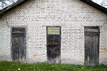 Image showing Three doors in the old garage.