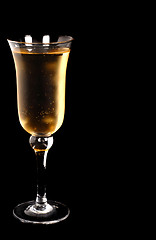Image showing Champagne in a crystal glass on a black background