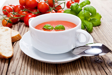 Image showing tasty fresh tomato soup basil and bread