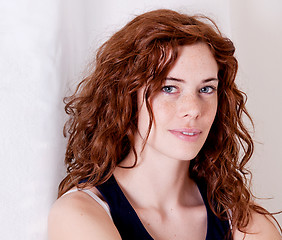 Image showing beautiful red head woman with freckle smiling