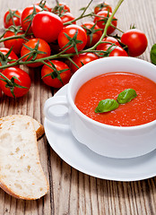 Image showing tasty fresh tomato soup basil and bread