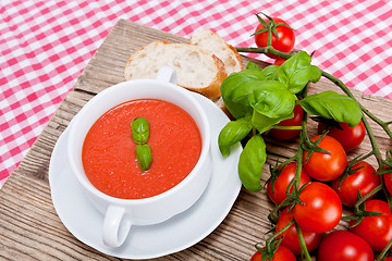 Image showing tasty fresh tomato soup basil and bread