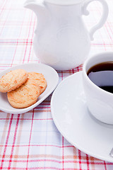 Image showing dark coffee in cup homemade cookie on table