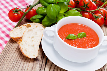 Image showing tasty fresh tomato soup basil and bread