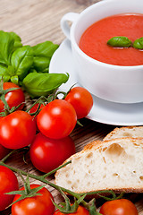 Image showing tasty fresh tomato soup basil and bread