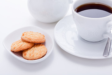 Image showing dark coffee in cup homemade cookie on table