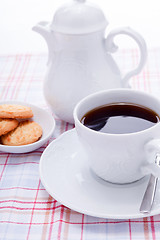 Image showing dark coffee in cup homemade cookie on table