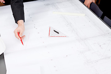 Image showing business people discussing architecture plan sketch 