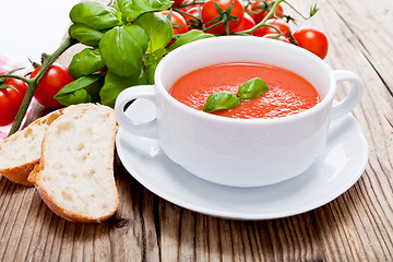 Image showing tasty fresh tomato soup basil and bread