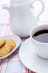 Image showing dark coffee in cup homemade cookie on table