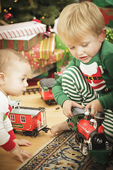 Image showing Young Boy Enjoying Christmas Morning Near The Tree