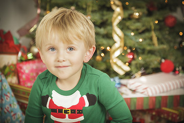 Image showing Young Boy Enjoying Christmas Morning Near The Tree