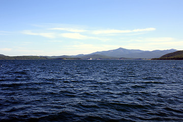 Image showing Sea landscape. Waves of sea of Japan and island in a distance. Russia