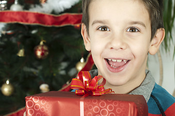 Image showing Happy child receive the gift of Christmas