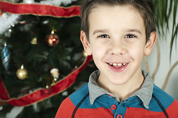 Image showing Happy children in front of Christmas tree