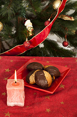 Image showing Christmas sweets and candle on the table