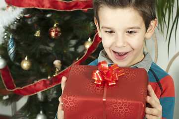 Image showing Happy child receive the gift of Christmas