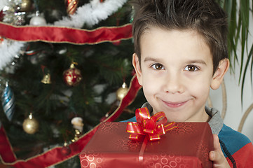 Image showing Happy child receive the gift of Christmas