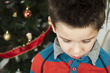 Image showing Unhappy little boy on christmass