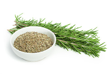 Image showing Fresh rosemary and a bowl with dried