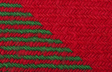 Image showing Handmade knit green and red background