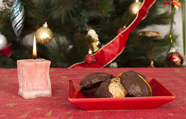 Image showing Christmas sweets and candle on the table