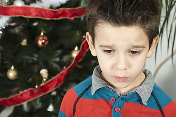 Image showing Unhappy little boy on christmass