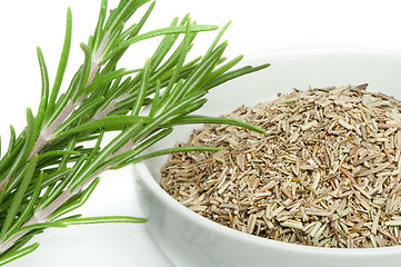 Image showing Fresh rosemary and a bowl with dried