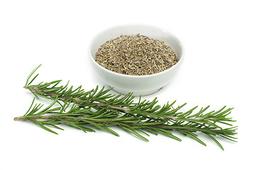 Image showing Fresh rosemary and a bowl with dried