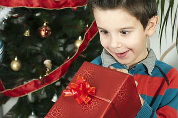 Image showing Happy child receive the gift of Christmas