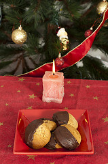 Image showing Christmas sweets and candle on the table