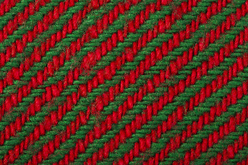 Image showing Handmade knit green and red background