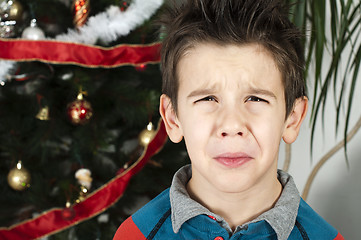 Image showing Unhappy little boy on christmass