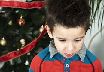 Image showing Unhappy little boy on christmass