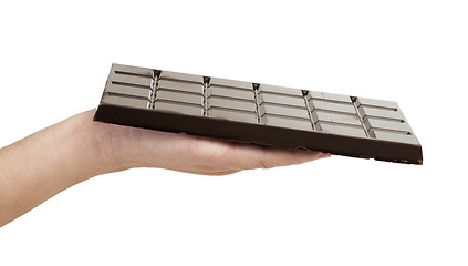 Image showing Hand holding chocolate bar