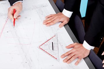 Image showing business people discussing architecture plan sketch 