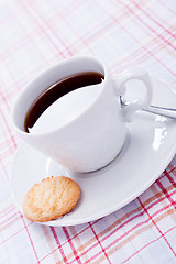 Image showing dark coffee in cup homemade cookie on table