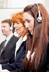 Image showing callcenter service team talking with headset