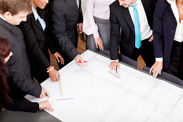 Image showing business people discussing architecture plan sketch 