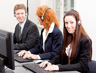 Image showing callcenter service team talking with headset