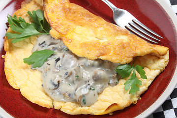 Image showing Souffle omelet with mushrooms in sauce