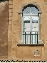 Image showing Decorative window on a brown wall