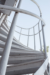 Image showing White iron steps of spiral staircase 