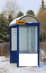 Image showing Bus Stop in Winter with Blank Billboard