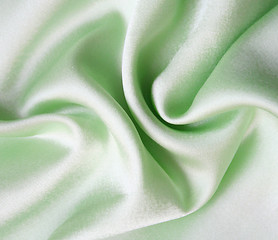 Image showing Smooth elegant green silk as background